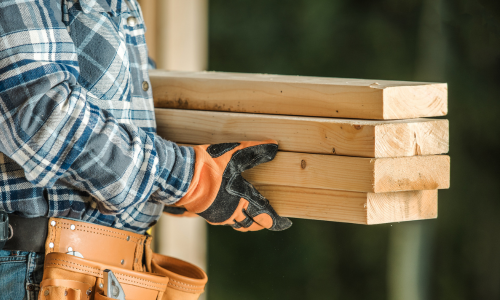 Man carrying lumber